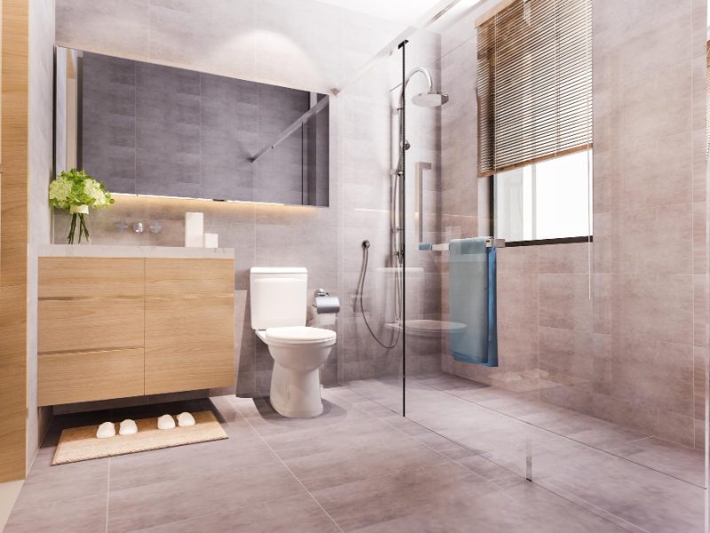 Professional Bathroom Renovation Wolverhampton installing a modern shower and vanity unit.